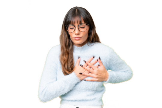 Young caucasian woman over isolated chroma key background having a pain in the heart