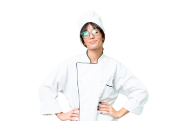 Young caucasian chef  woman over isolated chroma key background posing with arms at hip and smiling
