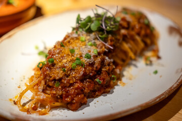 Spaghetti Bolognese, a meat-based sauce in Italian cuisine. served on plate