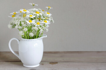 Bouquet with chamomiles and other wildflowers.