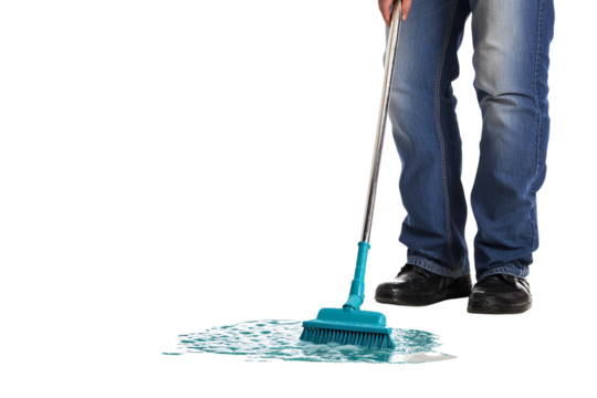 A person in blue jeans uses a cleaning brush to mop up a puddle of water, emphasizing the importance of cleanliness and household maintenance.