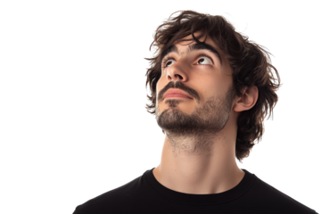A young man with curly hair gazes thoughtfully upwards. His expression reflects curiosity and contemplation, perfect for themes of introspection and aspiration.