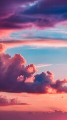 Fototapeta premium Colorful wallpaper purple orange blue pink sunset sky cloud. Dramatic sunset sky background. Sun Sets Over Horizon. Amazing Coral Pink Red Summer Cloud at Sunset. Beautiful Relax