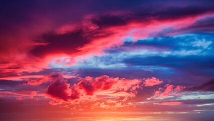 Obraz premium Colorful wallpaper purple orange blue pink sunset sky cloud. Dramatic sunset sky background. Sun Sets Over Horizon. Amazing Coral Pink Red Summer Cloud at Sunset. Beautiful Relax
