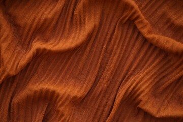 Bright orange fabric background from a piece of crumpled clothes
