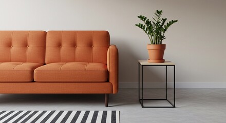 Interior of stylish living room with orange sofa, houseplant and table
