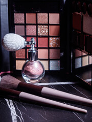 still life with cosmetics and glass