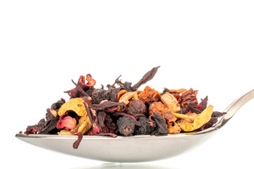 Carpathian forest aromatic tea with metal spoon, macro, isolated on white background.