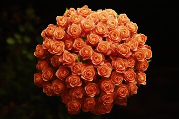 A bouquet of vibrant orange roses arranged in a vase