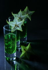 glass of champagne on green background