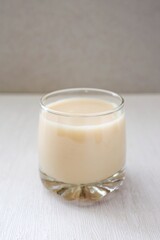 Glass of milk on white background