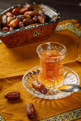 Azerbaijani black tea in armudu tea glass. Atmosphere of Baku and Eastern traditions. Oriental...