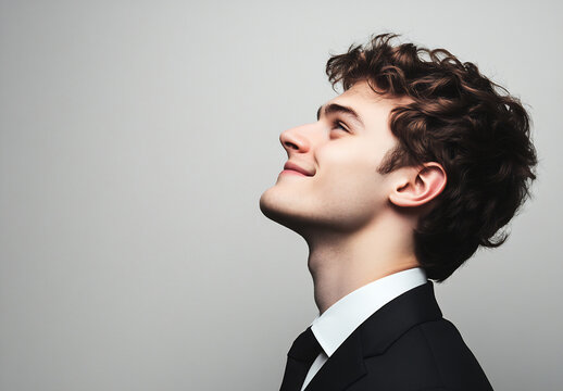 Young man smiles in formal attire