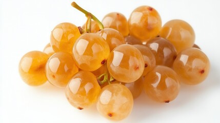 A cluster of fresh grapes resting on a clean white surface, showcasing their vibrant color and natural sheen.