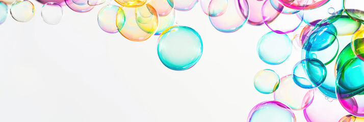 Colorful soap bubbles floating on white background creating abstract pattern
