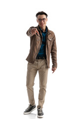 Fototapeta premium smart casual man pointing at you to make a choice