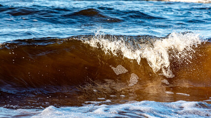beautiful waves crashing against the seashore, windy day on the rocky shore of Vidzeme, Baltic Sea