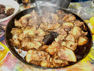 Fried meat with lard. In the pan, hot. National cuisine.