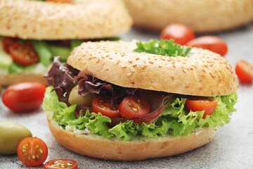 Sesame bagels with tomatoes and avocado
