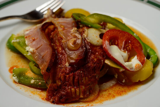 Racponty Hungarian Carp in the Style of Rac with Green Bell Peppers, Bacon, Tomatoes, Onion and Potatoes