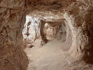 Coober Pedy, in South Australia, is the opal capital of the world, famous for its underground homes, churches, and shops built to escape the desert heat, offering a unique outback experience.