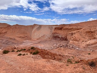 Coober Pedy, in South Australia, is the opal capital of the world, famous for its underground homes, churches, and shops built to escape the desert heat, offering a unique outback experience.