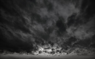 Fototapeta premium dark dramatic sky with black stormy clouds before rain as abstract background, extreme weather