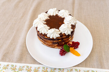Delicious dessert featuring layered cake with cream and fruit garnish