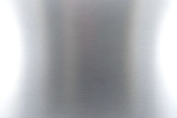 A smooth, reflective surface with a brushed metal texture, exhibiting subtle gradients of light and shadow.