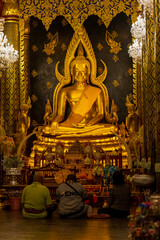 Phitsanulok, Thailand - November 27, 2024: Phra Buddha Chinnarat, Wat Phra Sri Rattana Mahathat, a highly revered Buddha image and a major tourist attraction.