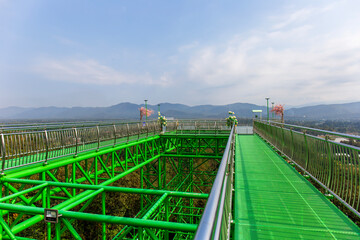 Fototapeta premium Chiang Mai, Thailand - December 9, 2024: Skywalk Wat Phra That Doi Saket.