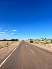 Kanku Breakaways Conservation Park, near Coober Pedy, features striking desert landscapes with colorful cliffs, vast plains, unique geological formations, and rich Aboriginal heritage.