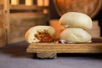 A close up of a sandwich with a bite taken out of it