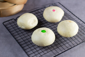 A rack of muffins with green and red sprinkles on top