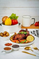 breakfast on the table with chicken and potatoes 
