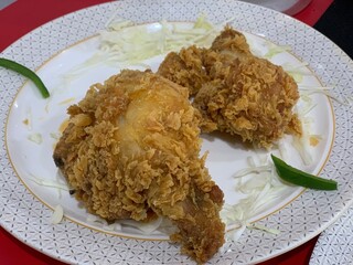 Fried chicken on a white plate, top view food table