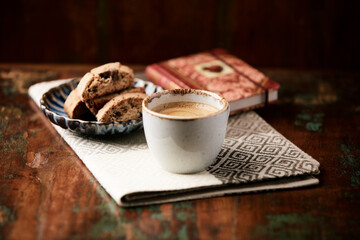 Cup of coffee and Cantuccini (Italian cookie) on dark wooden background. Copy space.	