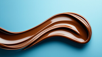 Rich and Smooth Chocolate Swirl on a Blue Background Creating an Appetizing Visual Experience