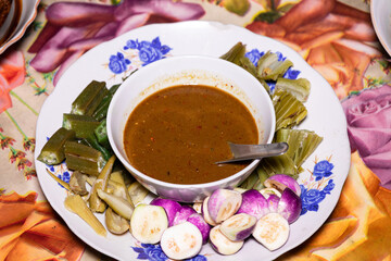Myanmar traditional Fish Preserve Sauce, which Burmese people call Ngapi yay and various boiled vegetables are sweet and delicious, Purple Eggplant, and okra.