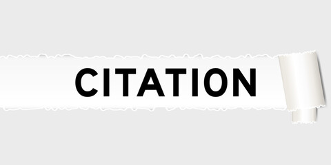Ripped gray paper background that have word citation under torn part