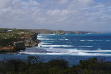 Loch Ard Gorge, situated along the Great Ocean Road in Victoria, is a stunning natural wonder featuring dramatic limestone cliffs, clear blue waters, and a historical shipwreck site, with walking trai