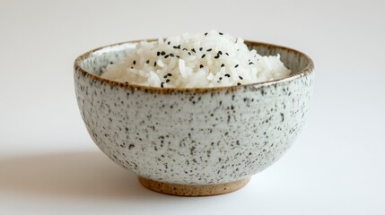 Delicious White Rice with Black Sesame Seeds in a Speckled Ceramic Bowl