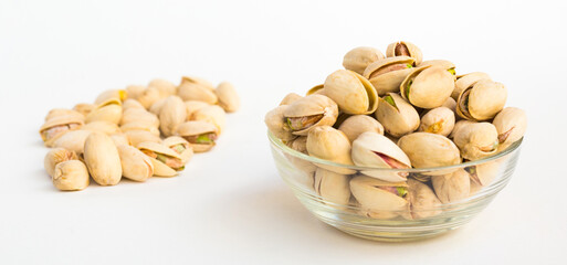 Roasted pistachios on white background