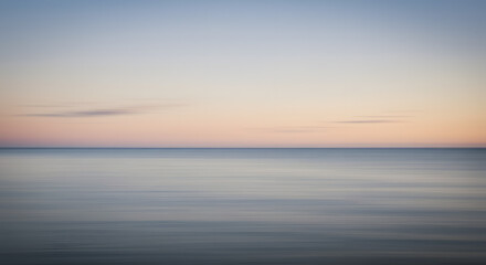 Fototapeta premium Endless Serenity: A Misted Horizon of Sea and Sky