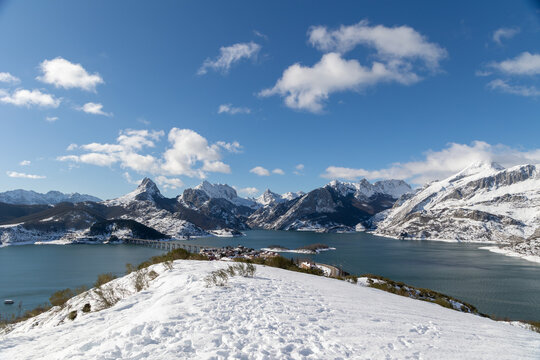 Stunning Winter Landscape of Ria&ntilde;o Reservoir with Snow-Capped Mountains in Le&oacute;n, Spain