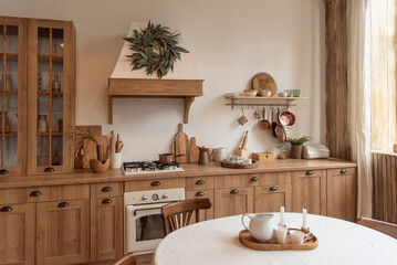 Rustic kitchen interior with wooden furniture and round dining table
