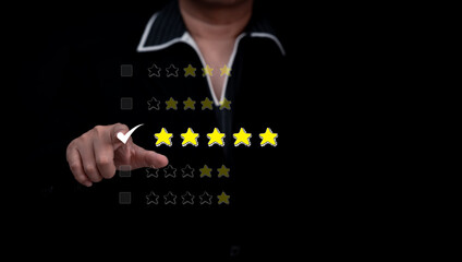 Concept of satisfaction and customer service. : Business man use use laptop touching or pressing the virtual screen Five score and five star to show satisfaction with the service or give rate.