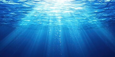 Underwater Scene Showcasing Sunbeams Penetrating Water Surface with Air Bubbles Rising