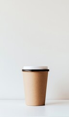 a brown paper cup with a white lid