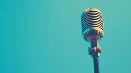 Obraz premium Retro Golden Microphone on Desk for Press Conference or Interview Against Mint Green Gradient Background. Vintage Broadcast, Journalism, and Media Presentation Theme